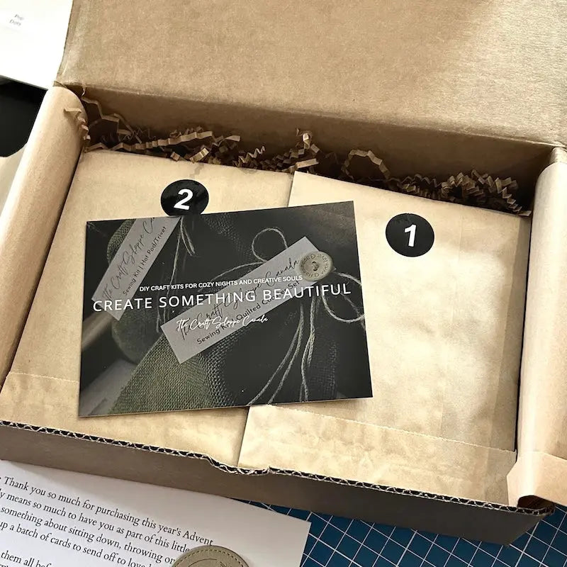 The Advent Calendar, sitting in a box being packaged to send off.