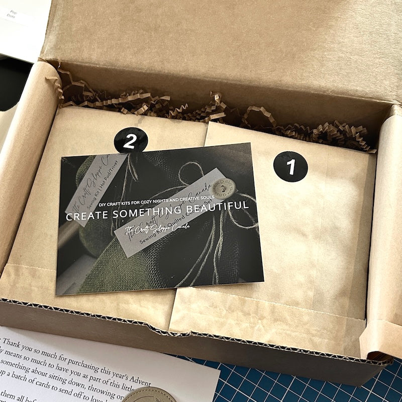 The Advent Calendar, sitting in a box being packaged to send off.
