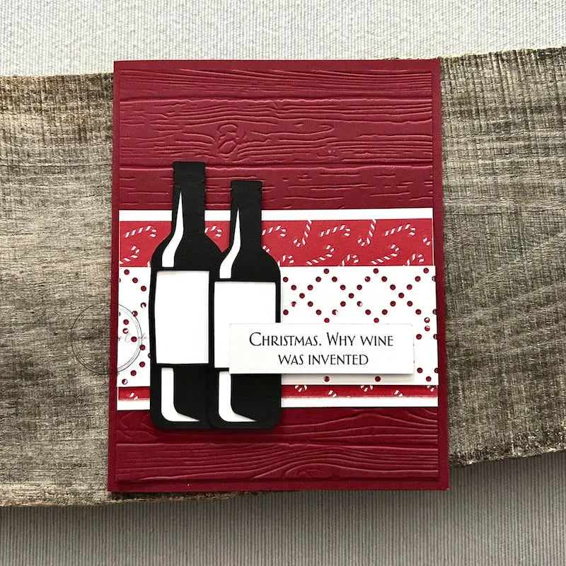 A finished card, from this card making kit, sitting on a wooden board.