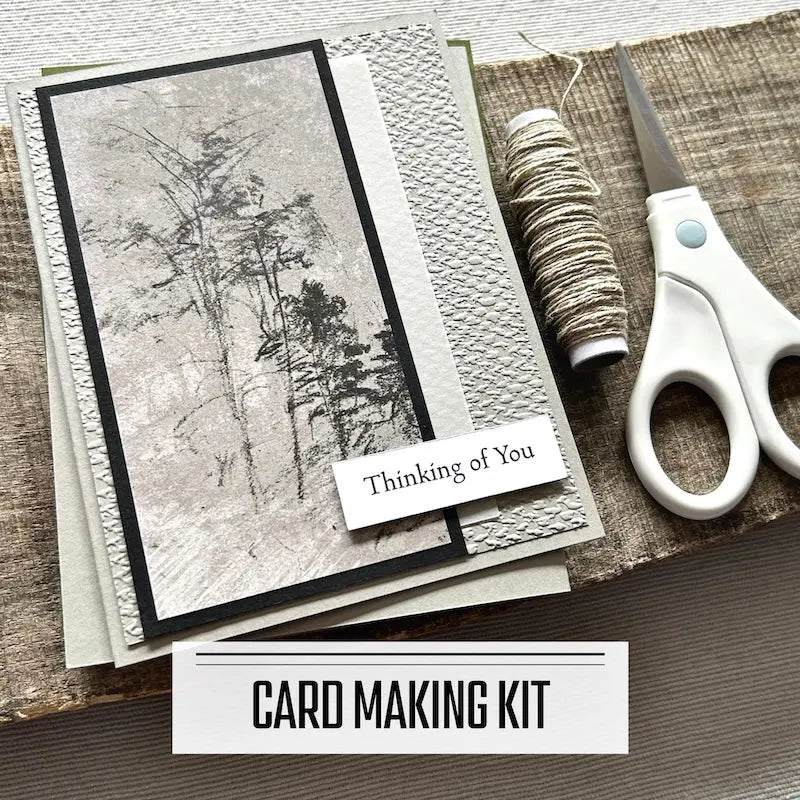 A DIY card making kit for cards with sympathy and get well soon sentiments. A finished card is sitting on blank cards with a roll of twine and scissors.