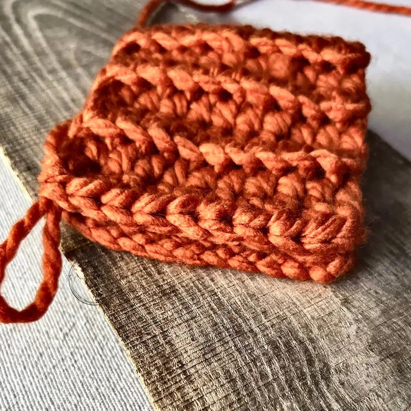 A small pumpkin, made from this crochet kit, is in the process of being made.