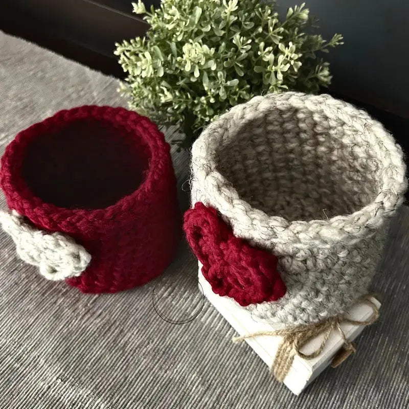The finished baskets, made from this crochet pattern, are sitting on a table.