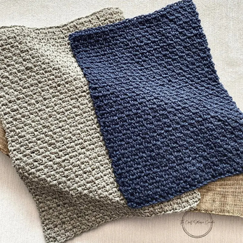 A close up of the navy and grey dishcloths made from this crochet kit.