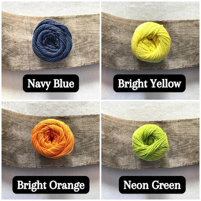 Colour options for your DIY crochet kit include navy blue, bright yellow, bright orange and neon green.