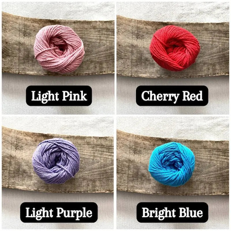 Colour options for your DIY crochet kit include cherry red, light pink, light purple and bright blue.