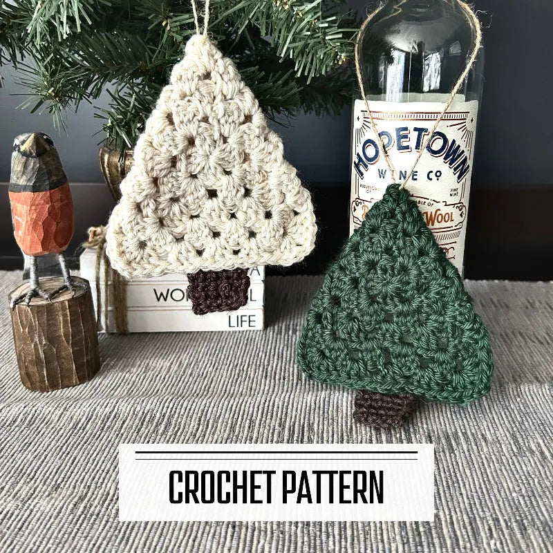 A DIY crochet pattern for Christmas tree Ornaments. The ornaments are hanging on Christmas tree, on a buffet, with a spring bird beside it.