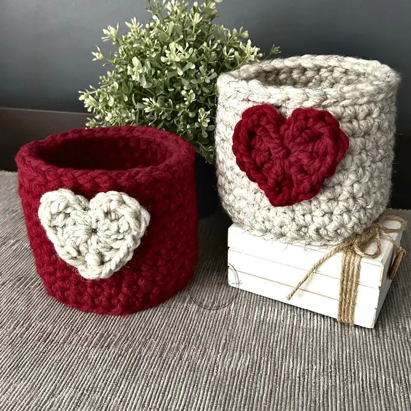 The finished baskets, made from this crochet pattern, are sitting on a table.