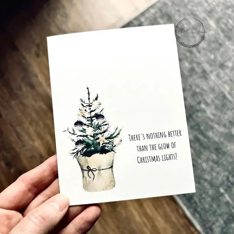 The printable greeting card is being held over a brown floor and grey carpet.