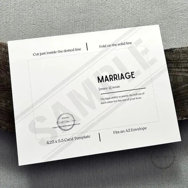 The PDF file of the printable greeting card is sitting on a wooden board to show what the template looks like.