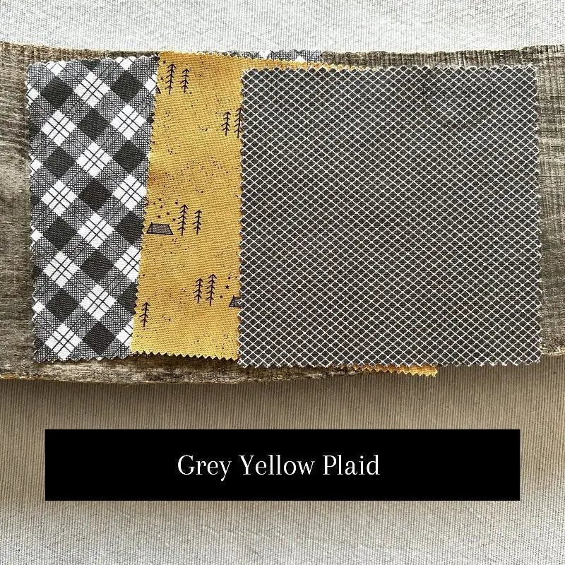 Fabric options for this sewing kit featuring grey and yellow colours.