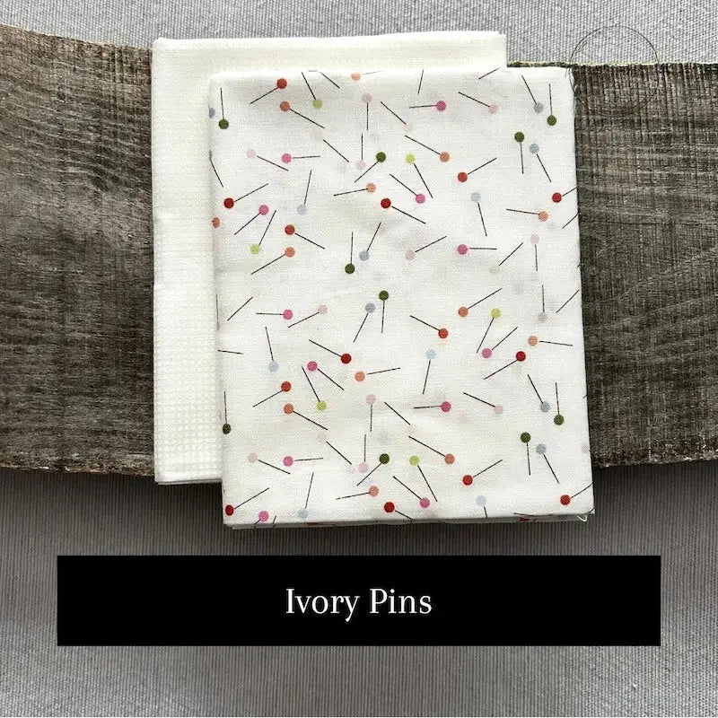Fabric options for this sewing kit featuring an ivory sewing pin pattern.