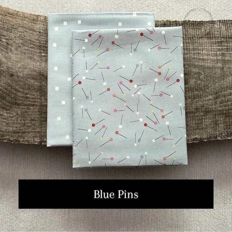 Fabric options for this sewing kit featuring a blue sewing pin pattern.