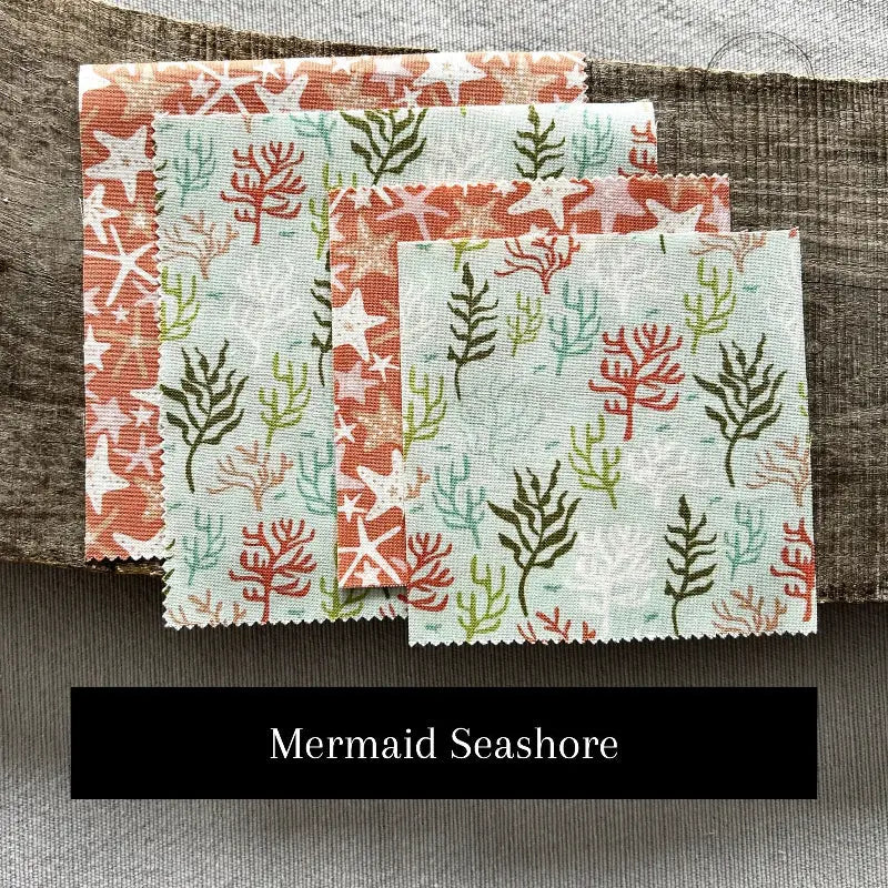 Fabric options for this sewing kit featuring a mermaid pattern of green and pink colours.