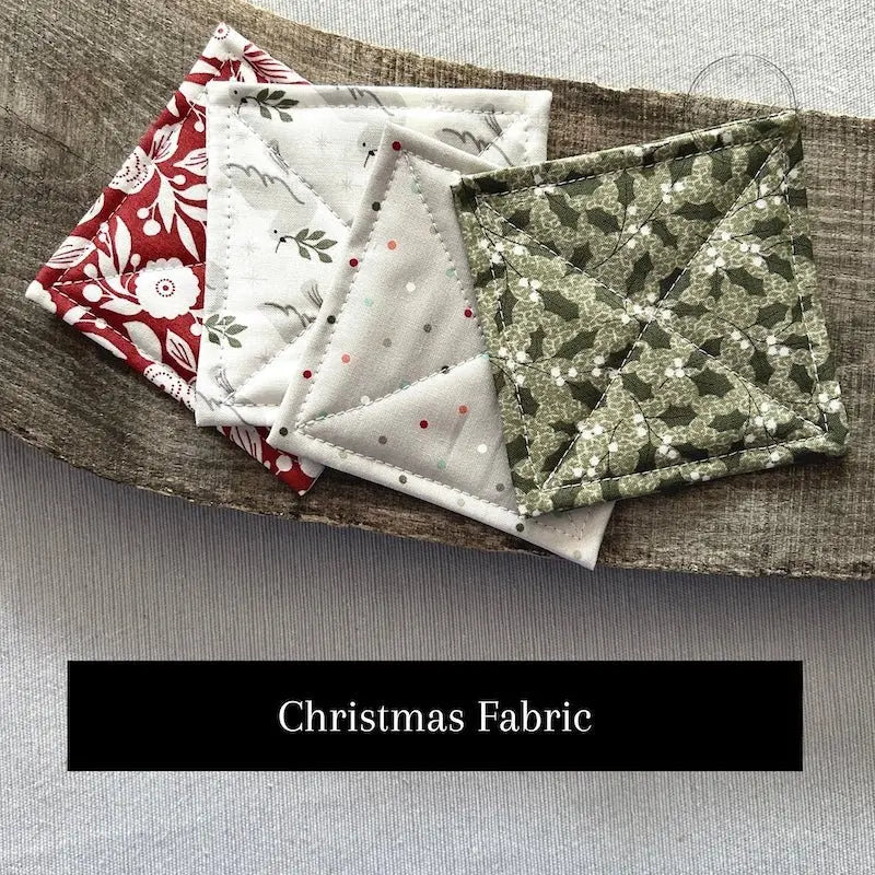 Fabric options for this sewing kit featuring a Christmas pattern of green and red colours.