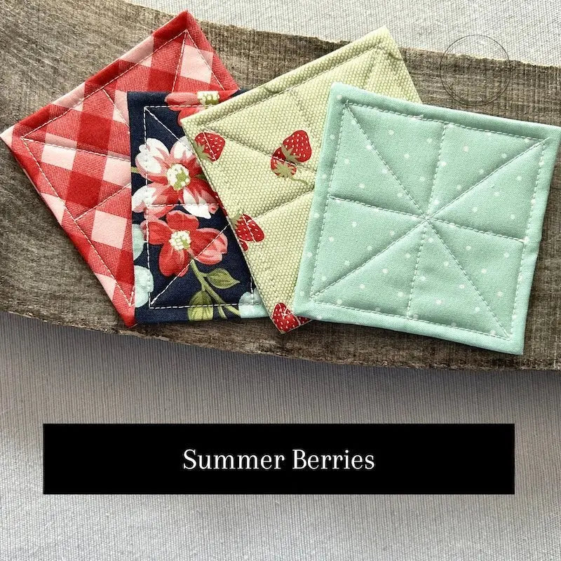 Fabric options for this sewing kit featuring a strawberry pattern of blue and red colours.