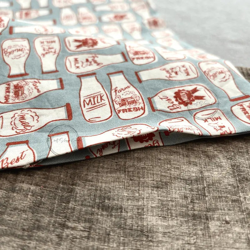 A look at the unfinished rice bag, made from this sewing pattern, on top of a wooden board.