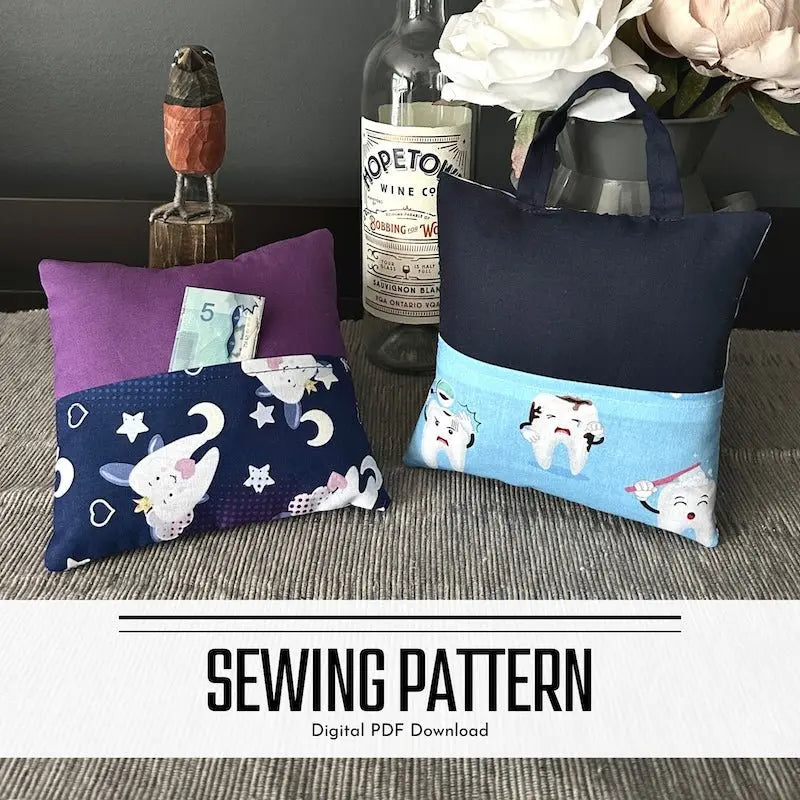 A digital PDF sewing pattern for a tooth fairy pillow. The 2 pillows are lying on a wooden board on a counter.