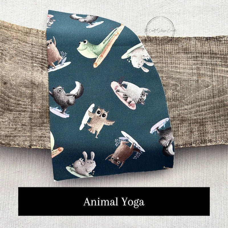 This photo shows one of the fabric options for the kit. This fabric pattern shows animals doing yoga - The Craft Shoppe Canad