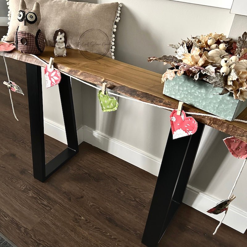 Finished hearts hanging on the garland with clothespins. The garland is laying on a table - The Craft Shoppe Canada