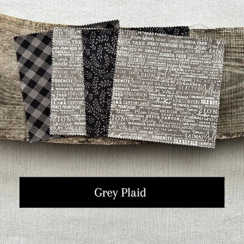 Fabric options for this sewing kit featuring a plaid floral pattern of black and grey colours.