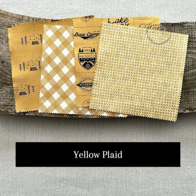 Fabric options for this sewing kit featuring plaid pattern of yellow and black colours.