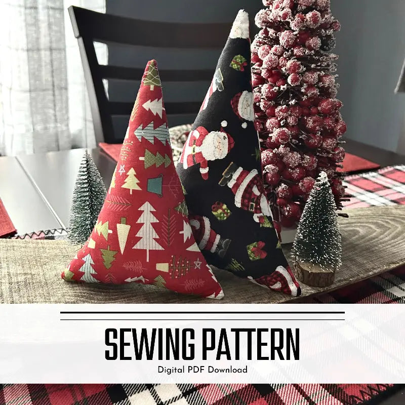 A digital PDF sewing pattern for a set of 2 Christmas trees. The 2 trees are sitting on a wooden board.