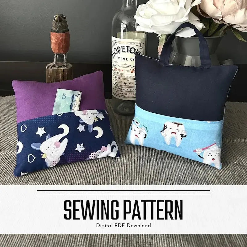 A digital PDF sewing pattern for a tooth fairy pillow. The 2 pillows are lying on a wooden board on a counter.
