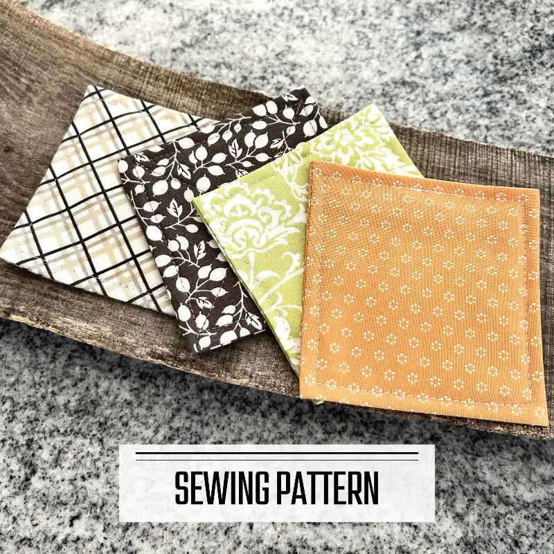 A digital PDF sewing pattern for a quilted coaster set. The finished coaster set is lying on a wooden board.