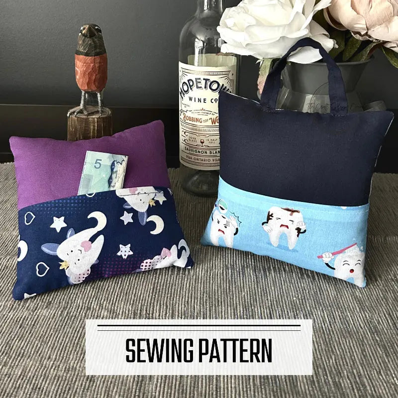 A digital PDF sewing pattern for a tooth fairy pillow. The 2 pillows are lying on a wooden board on a counter.