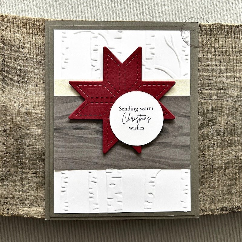 A finished card, from this DIY card kit, sitting on a wooden board.  - The Craft Shoppe Canada