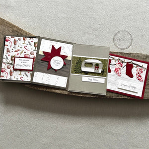 There are 4 finished cards, sitting on a wooden board, to show the finished cards that are included in this kit - The Craft Shoppe Canada