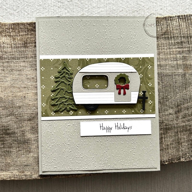 A finished card, from this DIY card kit, sitting on a wooden board.  - The Craft Shoppe Canada