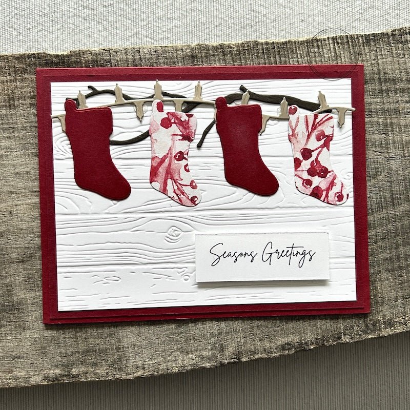 A finished card, from this DIY card kit, sitting on a wooden board.  - The Craft Shoppe Canada
