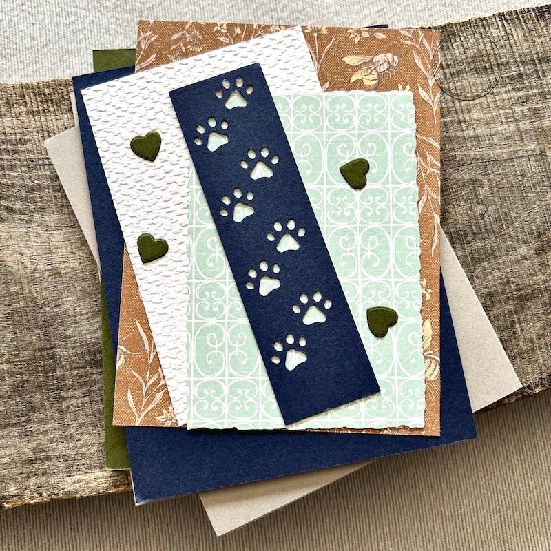 All of the card pieces are laying on top of cards. Everything comes cut and ready for assembly - The Craft Shoppe Canada