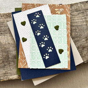 All of the card pieces are laying on top of cards. Everything comes cut and ready for assembly - The Craft Shoppe Canada