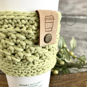 Close-up of a soft coffee sleeve made measuring 4 inches wide and 3 inches long in green - The Craft Shoppe Canada