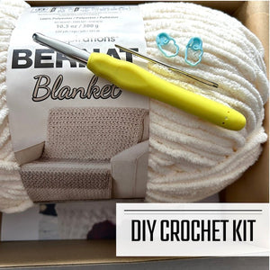 A DIY crochet kit for a Valentine’s heart-shaped basket, featuring white and red yarn, a crochet hook, and step-by-step instructions - The Craft Shoppe Canada