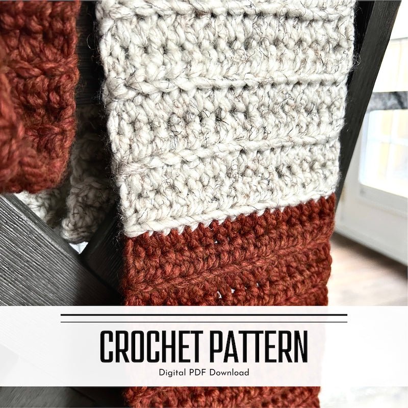 A digital crochet pattern for a chunky wool scarf. The scarf is laying over the back of a chair - The Craft Shoppe Canada