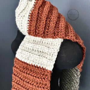 A close up of the finished scarf to feature the ivory, brown and orange colours. This scarf is the finished project for this digital crochet pattern - The Craft Shoppe Canada