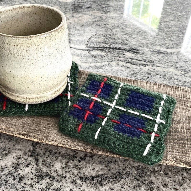 This photo features the finished set of coasters with a mug to show how big they are - The Craft Shoppe Canada