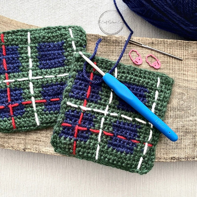 The completed coasters along with the yarn and crochet hook that were used for this coaster set  - The Craft Shoppe Canada