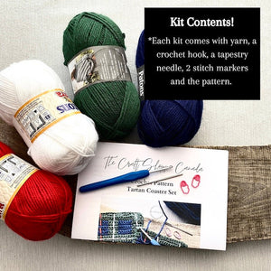 This photo lists the contents of the kit including the pattern, yarn, the optional crochet hook, a tapestry needle, 2 wooden rings and stitch markers - The Craft Shoppe Canada