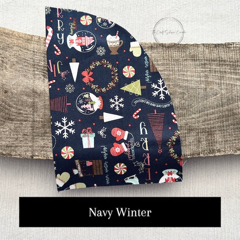 Fabric options for this DIY sewing kit featuring a Christmas pattern of navy blue and red colours - The Craft Shoppe Canada