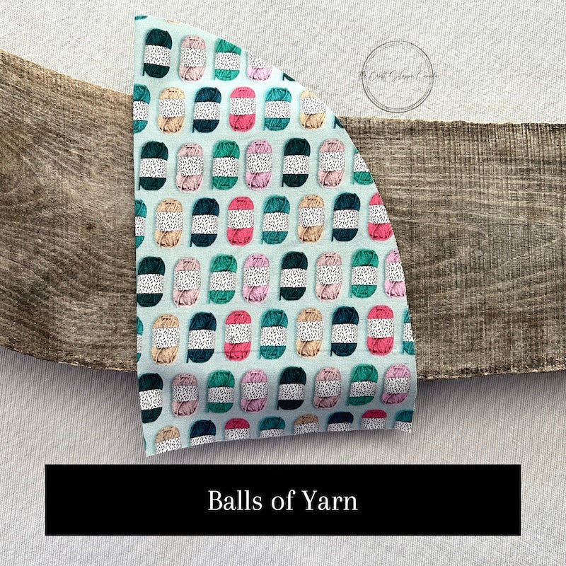 One of the fabric options for the kit. This fabric pattern shows balls of yarn - The Craft Shoppe Canada