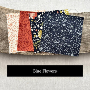 Fabric choices include a mix of blue and orange floral fabric squares when ordering your kit - The Craft Shoppe Canada