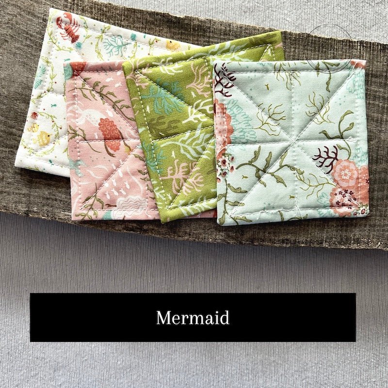 One of the fabric options for the kit. This fabric pattern shows a mermaid themed set - The Craft Shoppe Canada